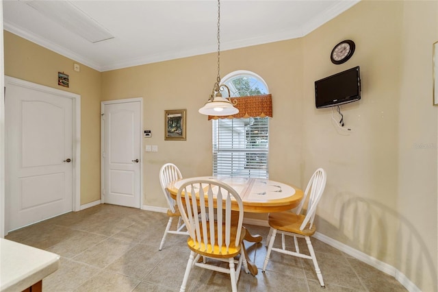 tiled dining room with crown molding