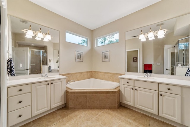 bathroom featuring separate shower and tub, tile patterned floors, and vanity