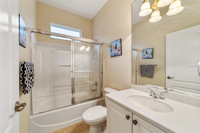 full bathroom with toilet, enclosed tub / shower combo, and vanity