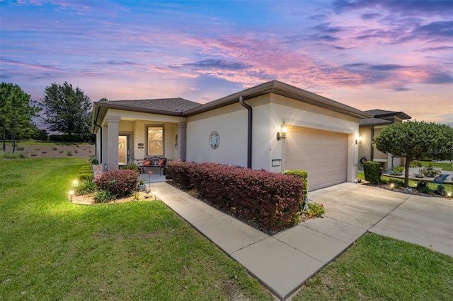 ranch-style house with a lawn and a garage