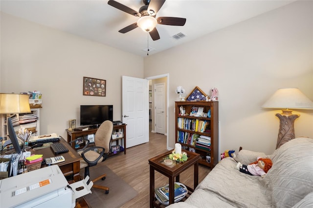 office with ceiling fan and hardwood / wood-style floors