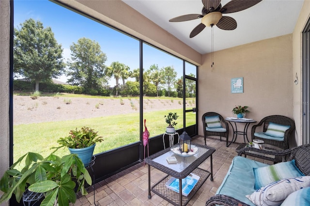 sunroom / solarium with ceiling fan