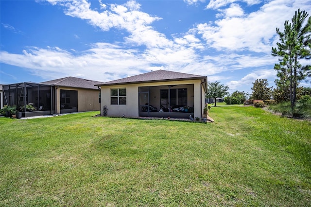 back of house featuring a yard