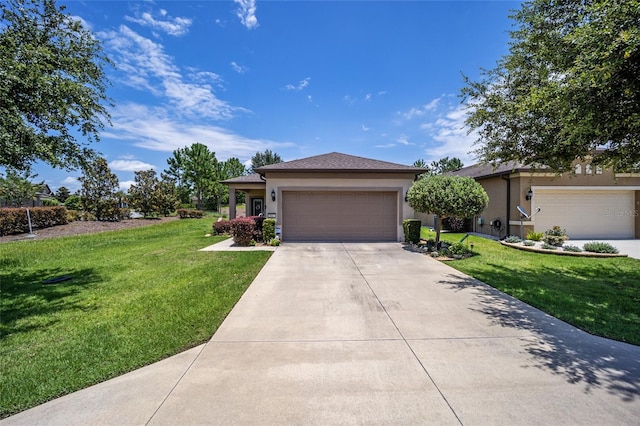 view of front of house featuring a garage and a front lawn