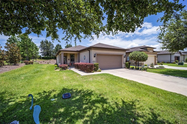 view of front of house with a front lawn and a garage