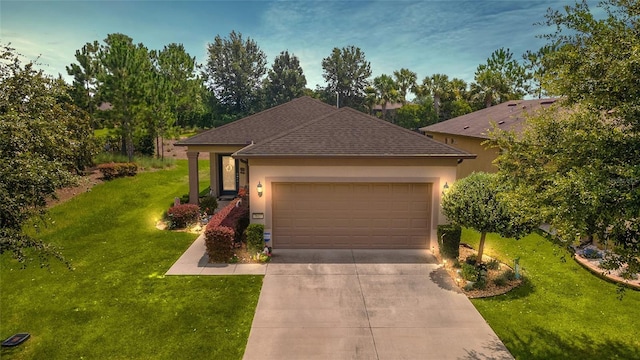 view of front of house featuring a front yard and a garage