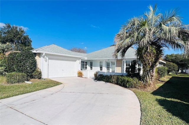 ranch-style home with a front yard and a garage