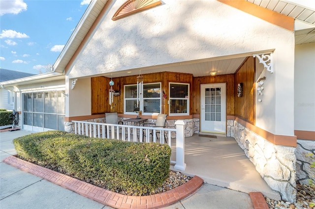 doorway to property with covered porch