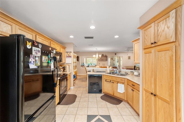 kitchen with kitchen peninsula, black appliances, pendant lighting, light brown cabinets, and light tile patterned floors