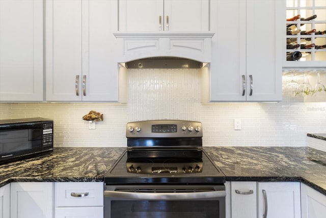 kitchen with stainless steel electric range oven, white cabinetry, and tasteful backsplash