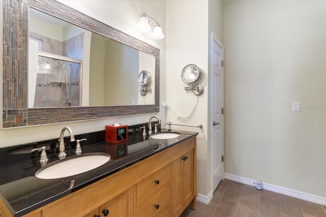 bathroom featuring an enclosed shower and vanity