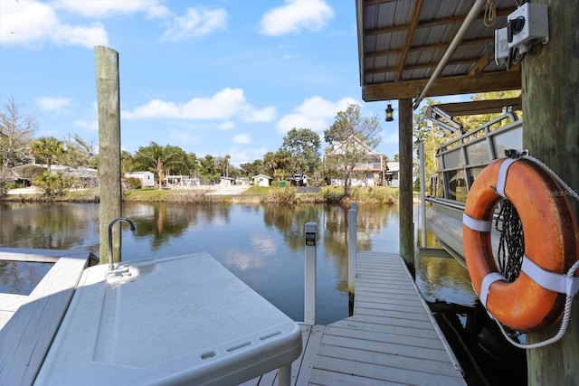 dock area featuring a water view