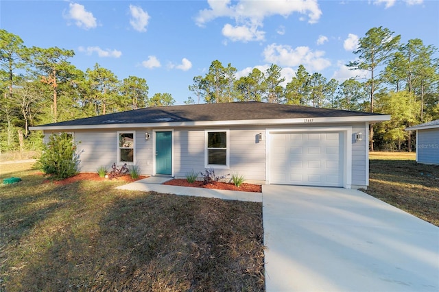 single story home with a garage and a front yard