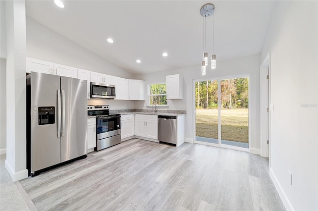 kitchen with white cabinets, sink, hanging light fixtures, light hardwood / wood-style floors, and stainless steel appliances