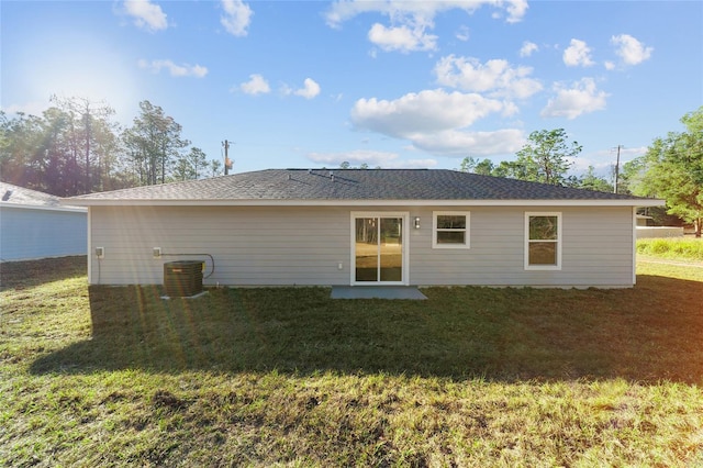 back of property with a yard and cooling unit