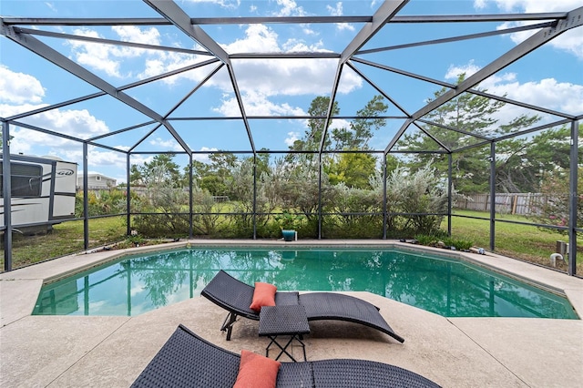 view of pool featuring a patio area and a lanai