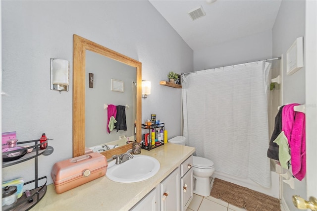 bathroom featuring toilet, vanity, and tile patterned floors