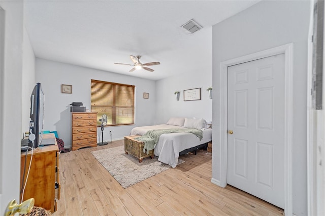 bedroom with ceiling fan and light hardwood / wood-style flooring