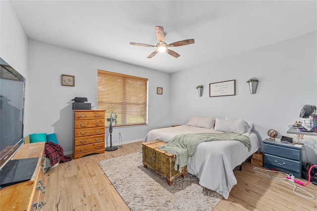 bedroom featuring ceiling fan and light hardwood / wood-style flooring