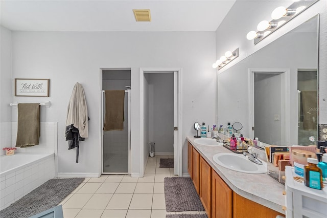 bathroom featuring separate shower and tub, tile patterned flooring, and vanity