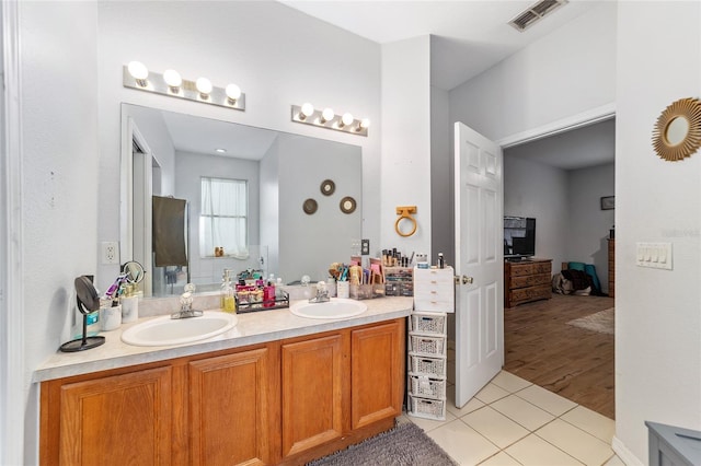 bathroom featuring tile patterned floors and vanity