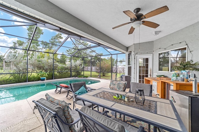 view of pool featuring a lanai and a patio