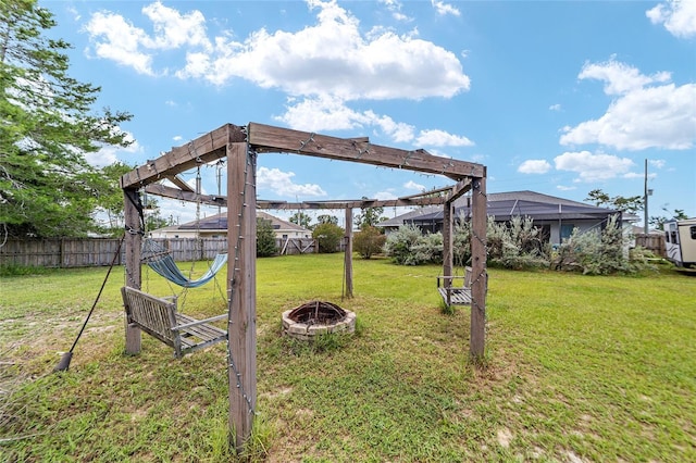 view of yard with a fire pit