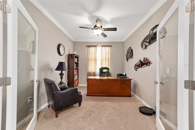 carpeted home office featuring a textured ceiling, ceiling fan, and ornamental molding