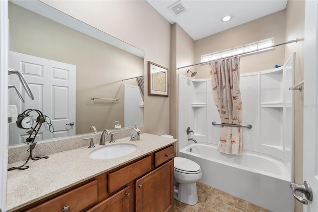 full bathroom featuring tile patterned flooring, vanity, toilet, and shower / tub combo