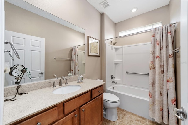 full bathroom with tile patterned flooring, vanity, toilet, and shower / bath combo