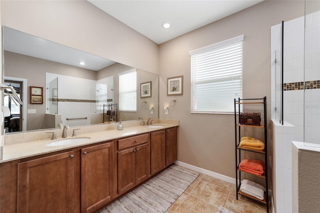 bathroom with vanity and tiled shower