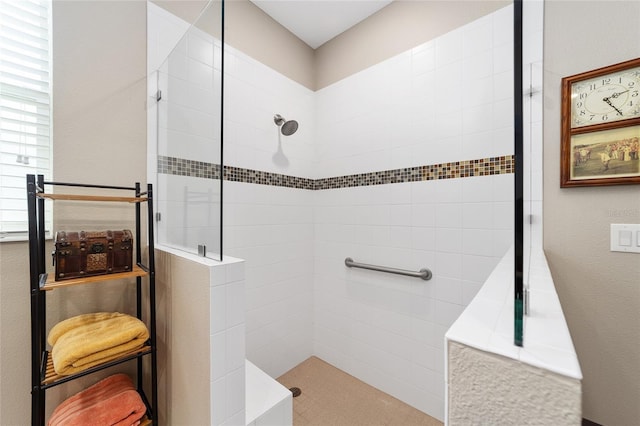 bathroom with tiled shower