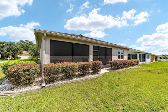 rear view of property with a yard