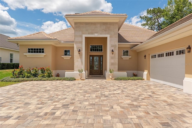 doorway to property featuring a garage