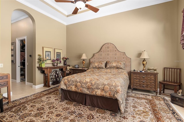 bedroom with ceiling fan and ornamental molding