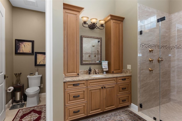 bathroom with tile patterned floors, vanity, toilet, and walk in shower