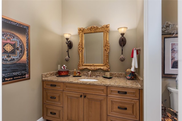 bathroom with vanity and toilet