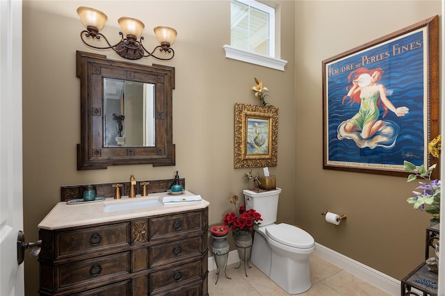 bathroom featuring tile patterned floors, vanity, and toilet