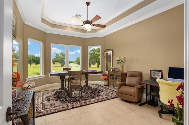 sunroom / solarium featuring ceiling fan and a raised ceiling