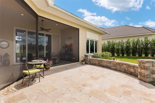 view of patio / terrace featuring ceiling fan