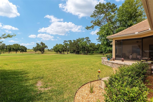 view of yard with a sunroom