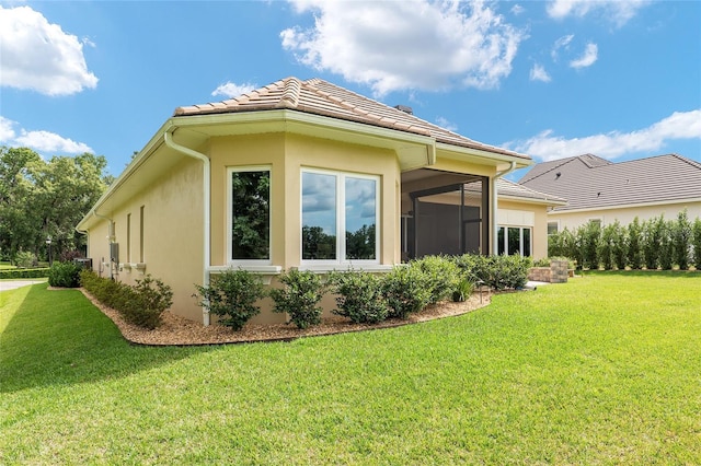 view of property exterior featuring a lawn