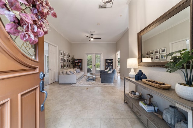 living room with ceiling fan, french doors, and ornamental molding