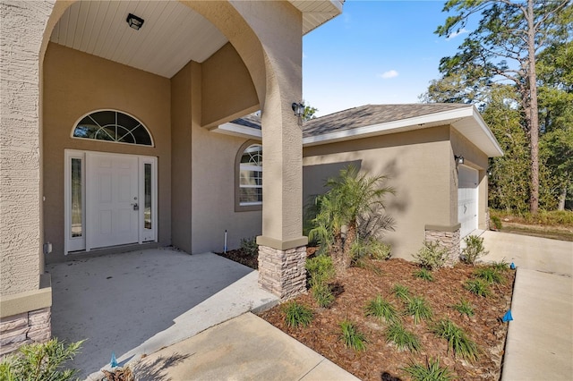 doorway to property featuring a garage