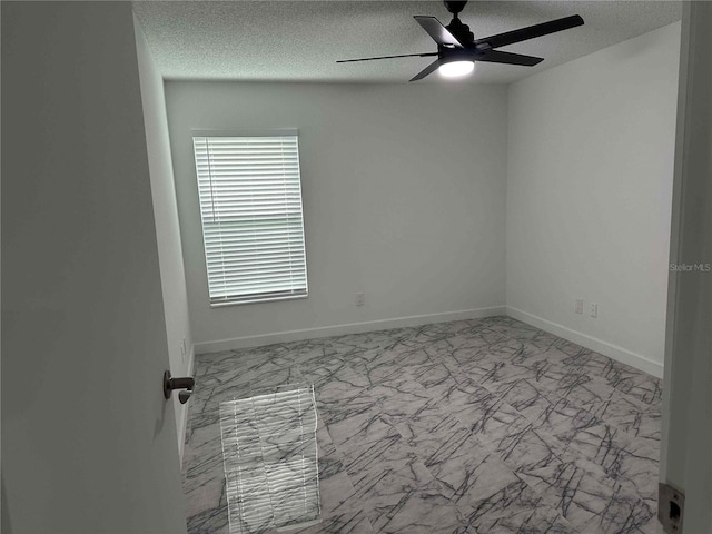 unfurnished room with a textured ceiling and ceiling fan