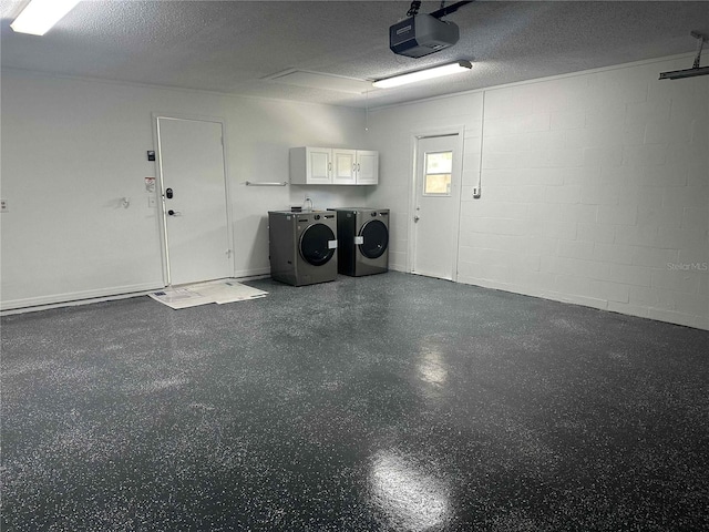 garage featuring a garage door opener and washing machine and dryer