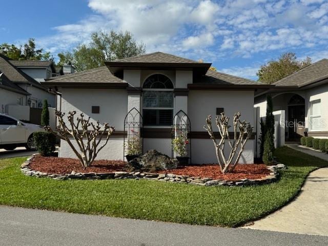 view of front of home featuring a front lawn