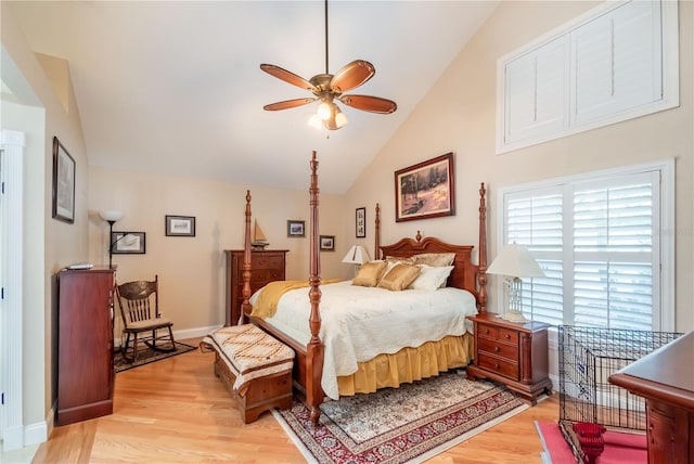 bedroom with lofted ceiling and light hardwood / wood-style floors