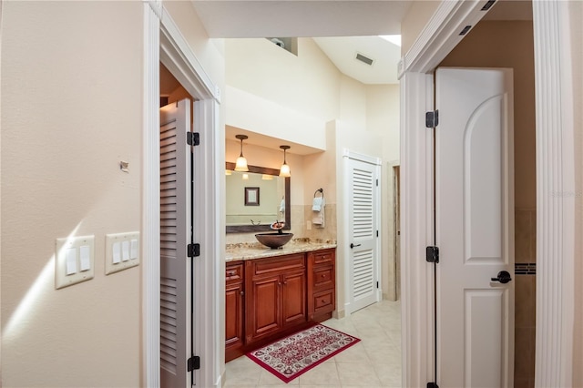 bathroom with vanity and tile patterned floors