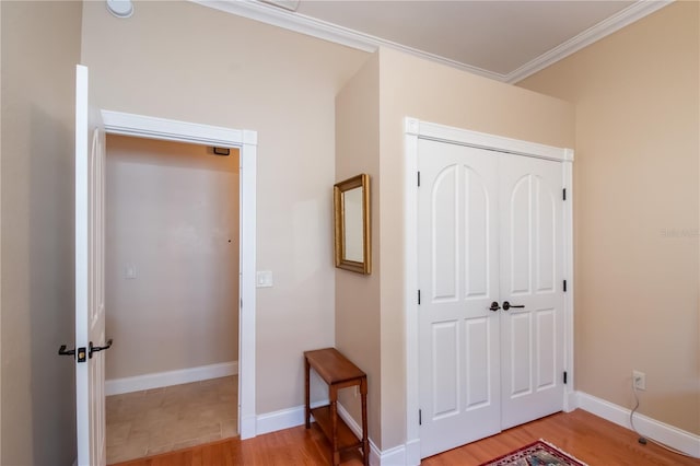 hall featuring hardwood / wood-style floors and crown molding